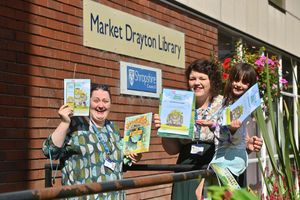 Market Drayton staff Catherine Westwood and Chantelle Tijhaar, with young bookworm Mary Rose Wilding, seven