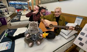 Musician Dan Whitehouse gets set for the Horizontal Concert, at Dreamland Beds, Brierley Hill, where the audience will listen to his music whilst lying in bed. He is pictured with Matt Randle from the store and organiser Frank Chamberlain. Photo Tim Thursfield
