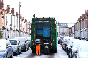 Agency refuse workers collect rubbish in the Saltley area of Birmingham