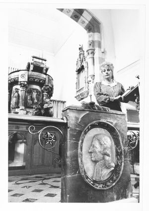 Stourport Methodist Church - the congregation was being evicted after the expiry of their lease on the building. The photograph shows Pauline Mothersdale with a plaque of John Wesley in the church in May 1989.