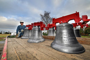 Volunteer Geoff Harding next to some of the bells.