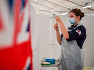 Supporting image for story: Royal Navy personnel among staff administering vaccines at Bath Racecourse