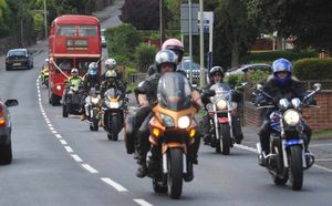 The bus and bike convoy heads for the church