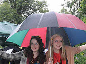 Supporting image for story: Brollies ready as rain is here to stay