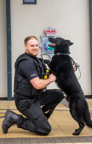 Pc Luke Hardern and PD Flash embrace