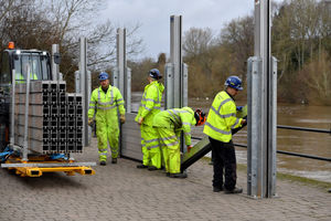 Workmen rush to erect the flood barriers in Bewdley