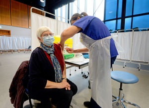 Marian Thomas, 80, of Wellington, gets her jab from staff nurse Ruby Mander