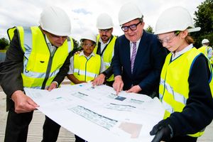 Labour deputy leader Tom Watson looks over plans for the school extension