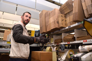 Amazon staff box and wrap items for dispatch at the Amazon Fulfilment Centre in Sutton Coldfield on Tuesday, December 10, 2024. (Mike Sheridan/Express and Star)