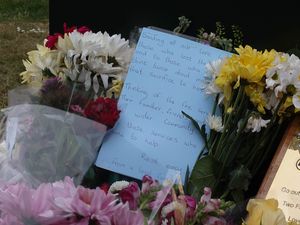 Floral tributes left near the scene of a fire at Bicester Motion