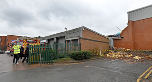 Fire crews at Shell Corner Business Park, Halesowen, after a wall collapsed onto another industrial unit