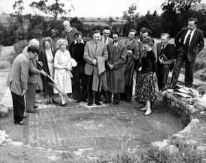 Yarchester Roman site near Much Wenlock, July 29, 1958: Part of the caption is missing, but we can make out the following: 'Shropshire summer school for secondary modern teachers, which is being held at Shrewsbury, visited the Roman villa at Yarchester yesterday. Mr J. Corbett (left)...(about three words missing) class, is history master at Much Wenlock secondary modern school.'