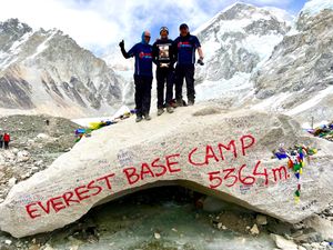  A delighted Barry Mason, James Davison and Jonathan Davison at the Everest Base Camp marker stone