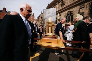 The relics are carried into the cathedral