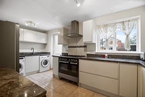A practical kitchen space with ample storage keeps everyday cooking simple and efficient