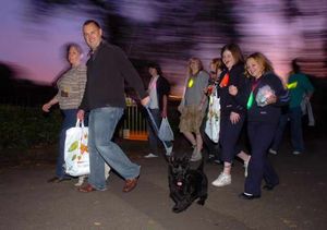 Friends, families, colleagues and even family pets donned glowing necklaces and waved torches to light the way around the park's lake last night.nextpage
