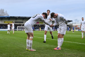 Jamie Meddows celebrates his goal against King's Lynn with Remi Walker. Pic: Kieren Griffin
