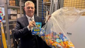 Councillor Anthony Screen with seized Jolly Rancher products