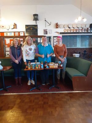 Alex Ash, with staff at Newport's food bank