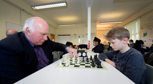 Mike Hoare, a county player for Staffordshire, and Norton Canes Chess Club founder kicks off the competition with eleven year old Jude Haycock