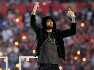 Supporting image for story: Eminem takes knee in apparent nod to Colin Kaepernick at Super Bowl halftime