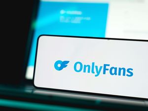 Onlyfans logo and website displayed on smartphone screen
