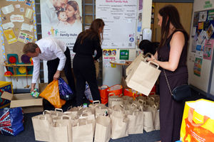 Opus People Solutions packing food parcels.