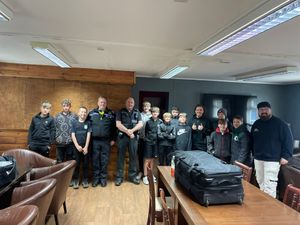 Juniors at Market Drayton Tigers FC with police officers. 
