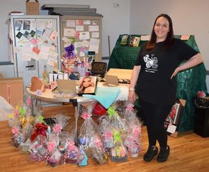 Becky's sister Jess with the raffle prizes  