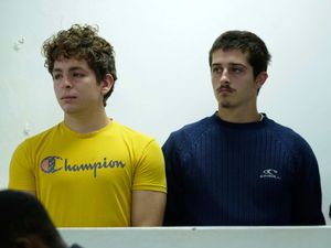 Belgian nationals Lornoy David, left, and Seppe Lodewijckx appear at the Jomo Kenyatta International Airport Law Courts in Nairobi, Kenya