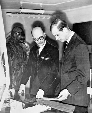 1954: The Duke of Edinburgh looks at frogmen's equipment with Dr J R Scott, director of research at the Rubber Research Association laboratories at Shawbury