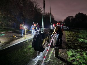 Supporting image for story: Land Rover found dumped in Black Country canal is lifted out of lock by crane