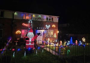 A big inflatable Santa welcomes people to this house in Knighton