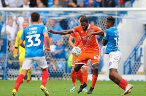 Anthony Grant of Shrewsbury Town and Jamal Lowe of Portsmouth. (AMA)