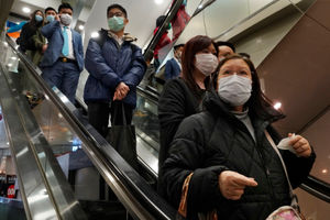 People wear face mask at a shopping mall in Hong Kong