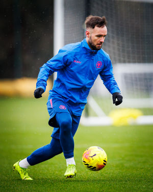 Adam Armstrong on the ball in training (Photo by Brett Patzke - WWFC/Wolves via Getty Images)