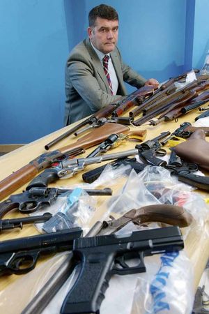 Andy Bannister with some of the weapons seized