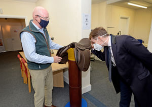 West Midlands Mayor Andy Street takes a closer look at a saddle with Patrick Burns