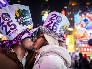 Supporting image for story: The world welcomes 2025 with light shows, embraces and ice plunges