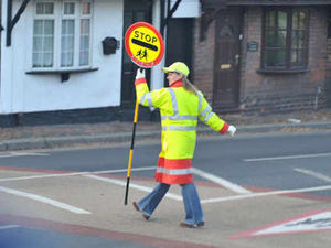 Supporting image for story: £1,500 to move lollipop lady 100yds - and back