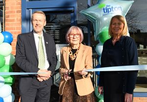 Megan Barrow prepares to cut the ribbon at The Tipton &amp; Coseley Building Society in Codsall, joined by the building society’s chief executive Adam Evetts and newly appointed branch leader Karen Perkins
