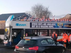 Supporting image for story: Four in hospital after roof of double-decker bus ripped off in bridge collision