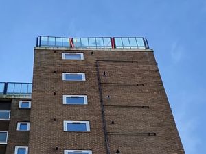 Supporting image for story: Emergency action needed after loose glass panels found on roof of flats in Brierley Hill
