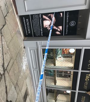 Police tape was around Goldsmiths of Shrewsbury where £20,000 worth of watches were stolen
