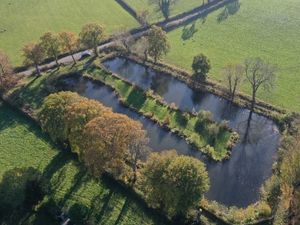 Supporting image for story: New lodges approved by planners at a fishing pool near Newtown