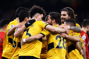 Wolves players celebrate together as a 4-0 win over Watford continues their climb (Getty)