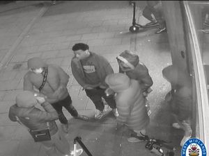 Supporting image for story: CCTV images released after man robbed of bag and phone in street