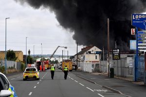 Black smoke pours into the sky from the fire at GB Tyres in West Bromwich. Photo: Tim Thursfield