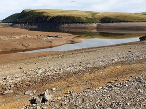 Supporting image for story: 'More than just a weekend's rain' is needed as photos reveal half-empty reservoir