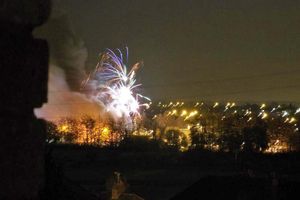 Fireworks could be seen next to thick grey smoke during the blaze